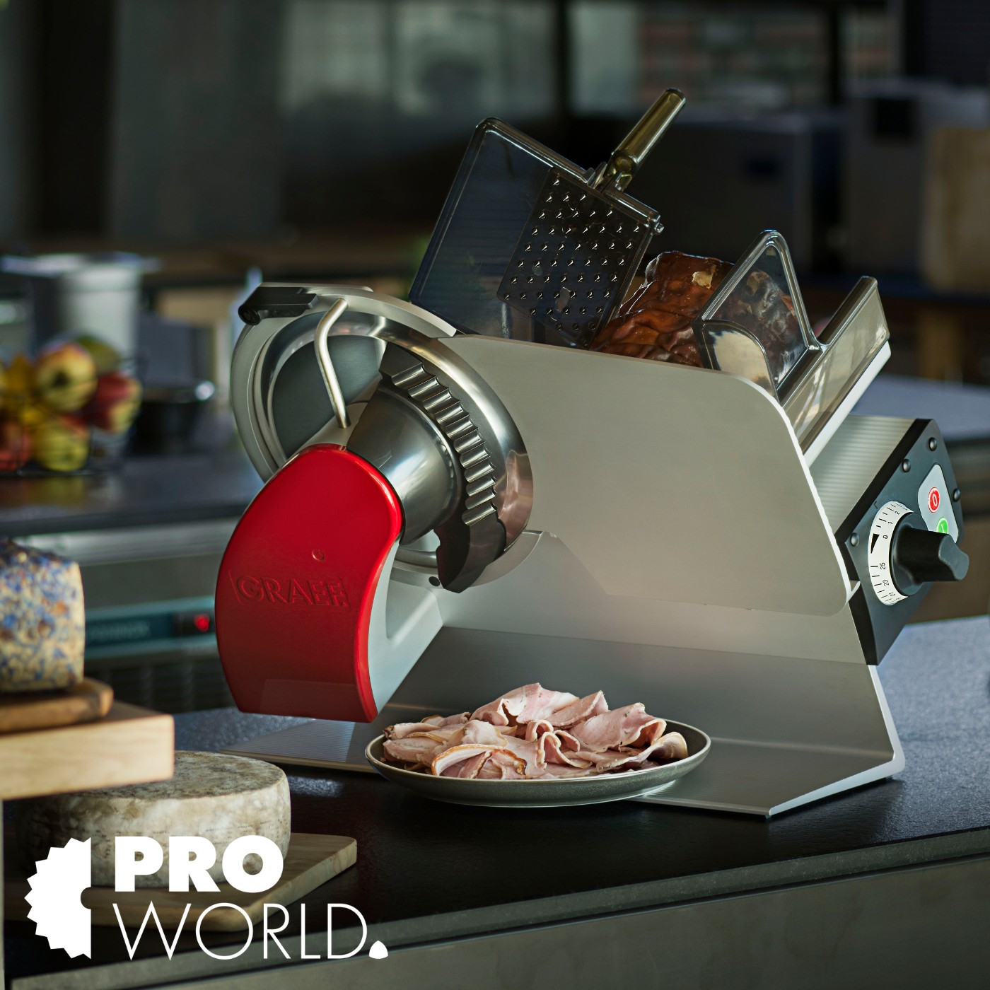 Meat slicer with red handle and sliced meat on a plate, kitchen setting.
