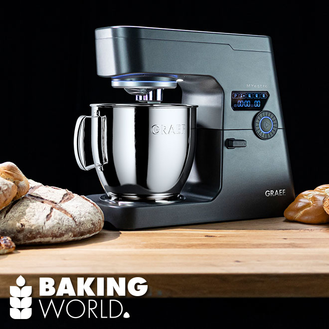 Graef stand mixer with bread on wooden surface, Baking World logo