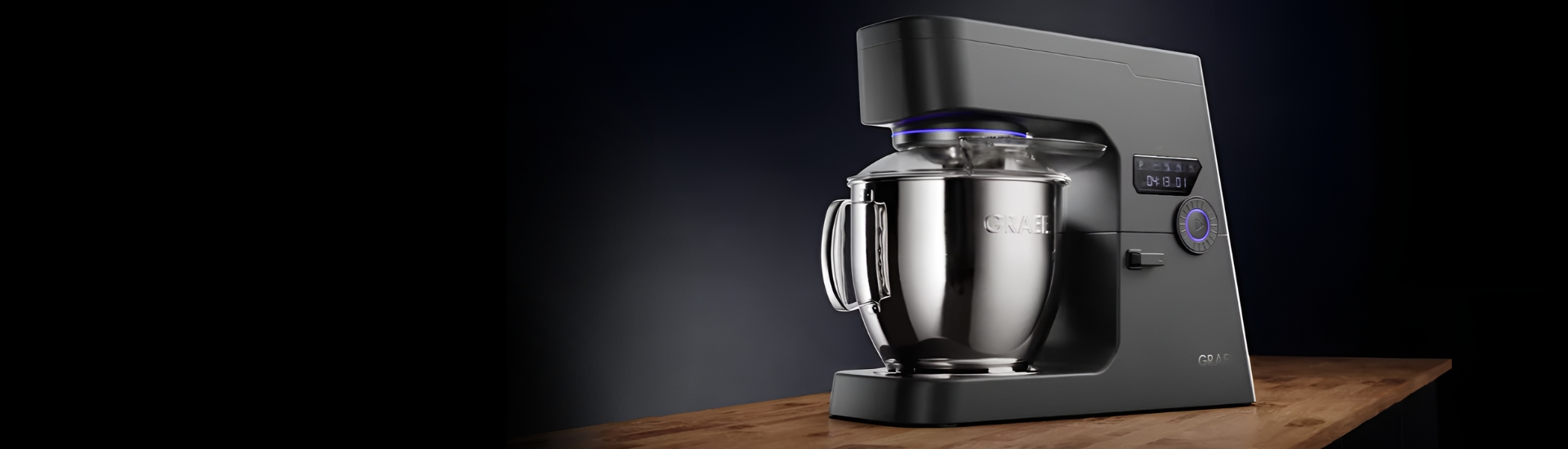Black Graef kitchen machine on wooden surface, studio shot, close-up view