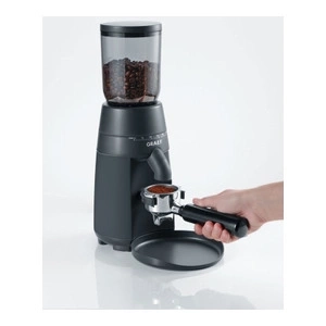 Coffee grinder with beans and portafilter, ready for espresso.