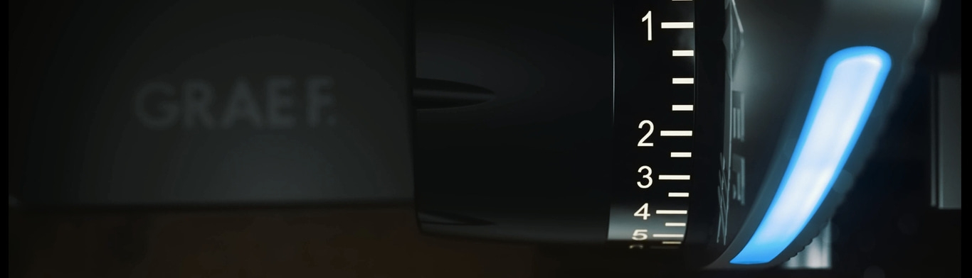 Gros plan d'un appareil noir avec éclairage bleu et une échelle de 1 à 5.