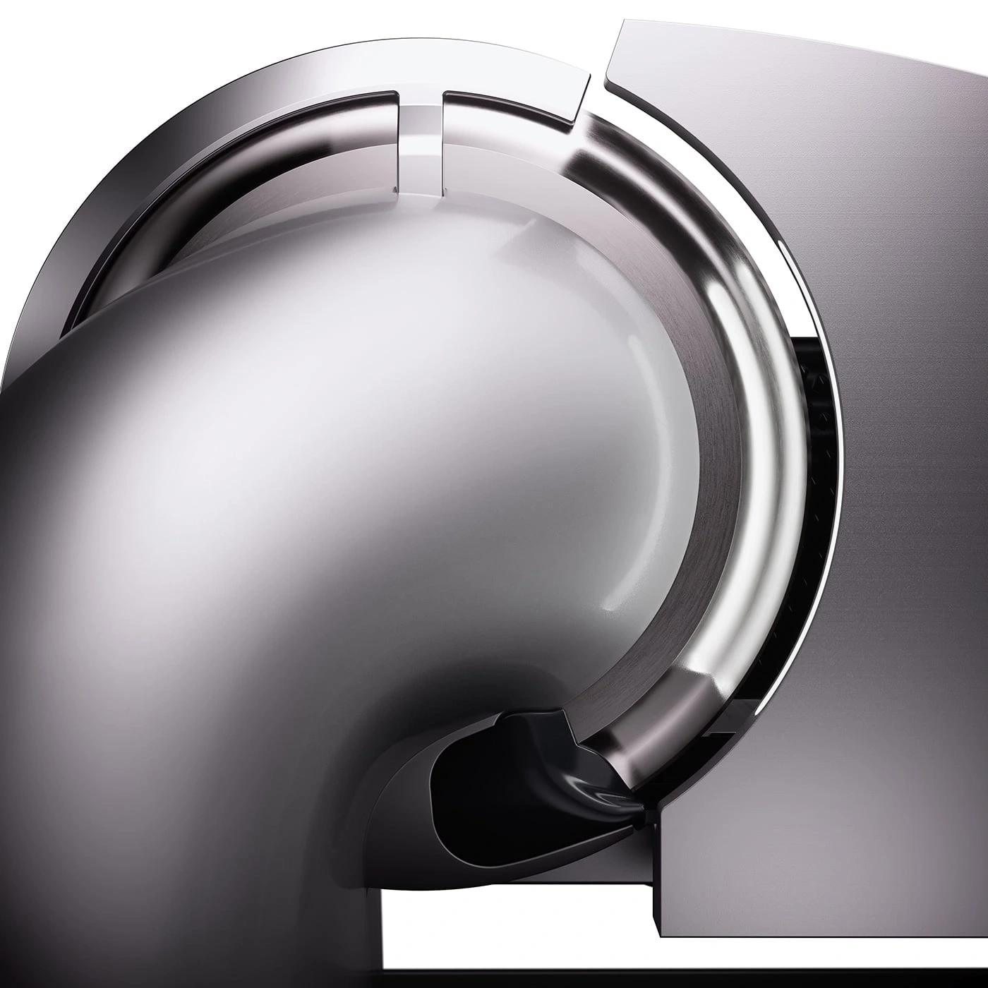 Shiny metal object with round and angular shapes, close-up detail, smooth surface