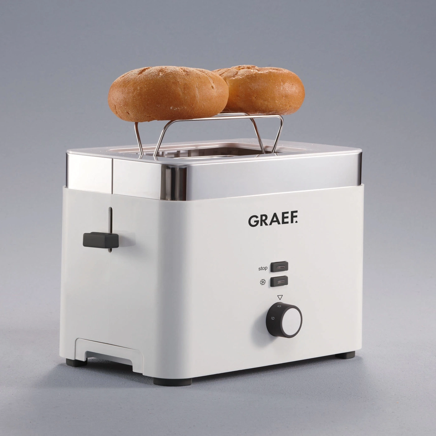 White toaster with buns, GRAEF brand, on a gray background.