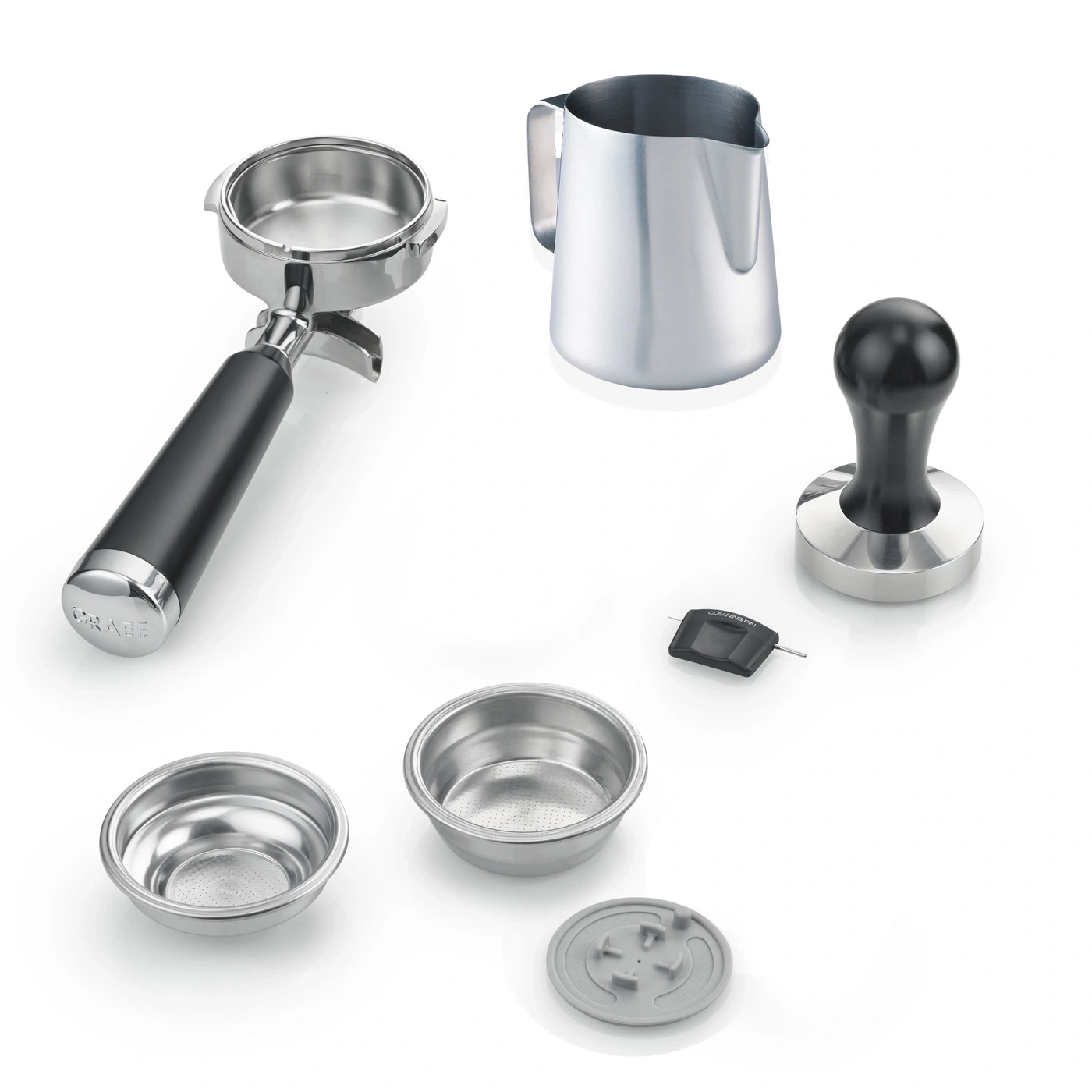 Espresso machine accessories: portafilter, milk pitcher, tamper, baskets, cleaning tool, and cover.