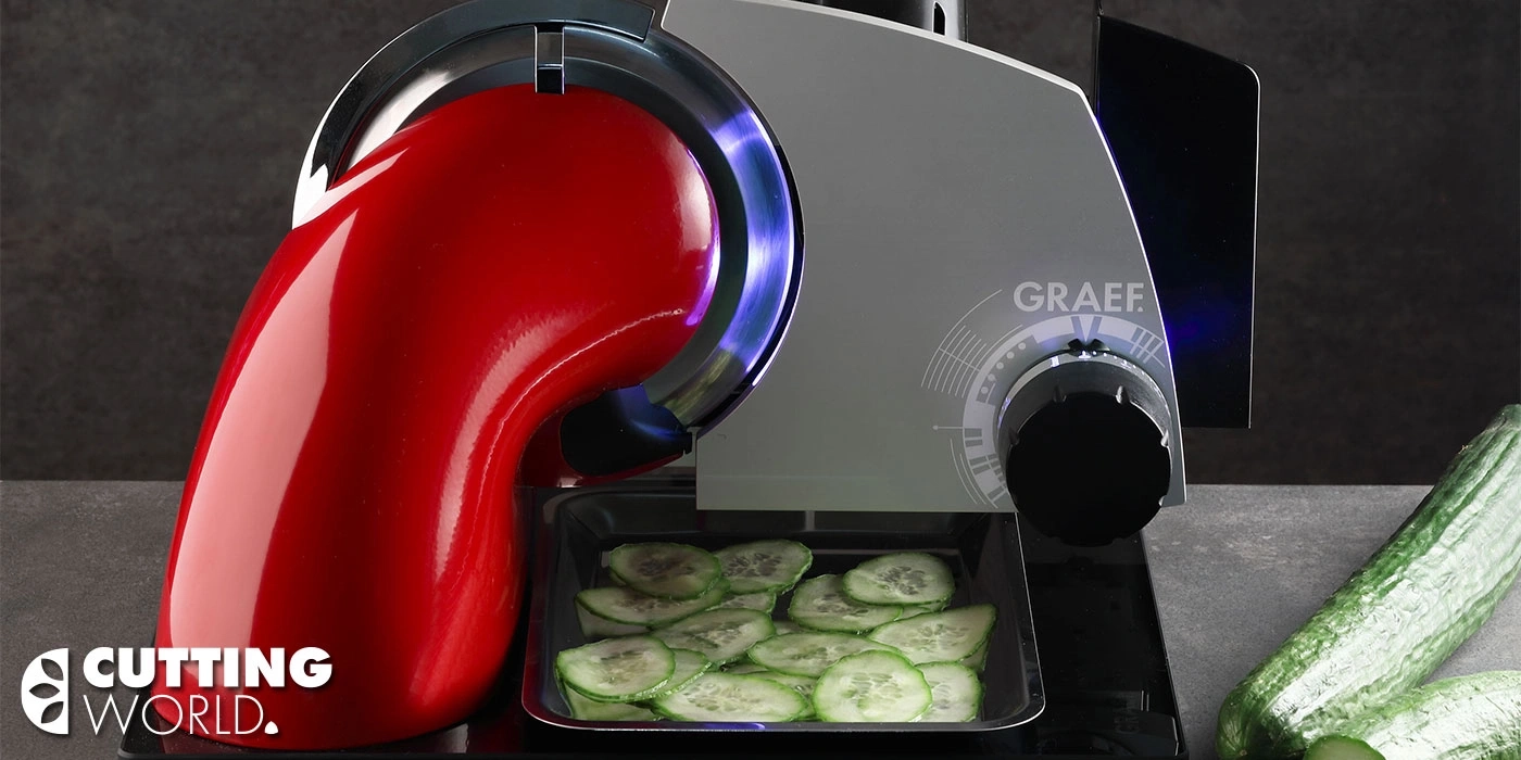 Vegetable slicer with cucumbers being sliced on a gray background, cutting world logo.