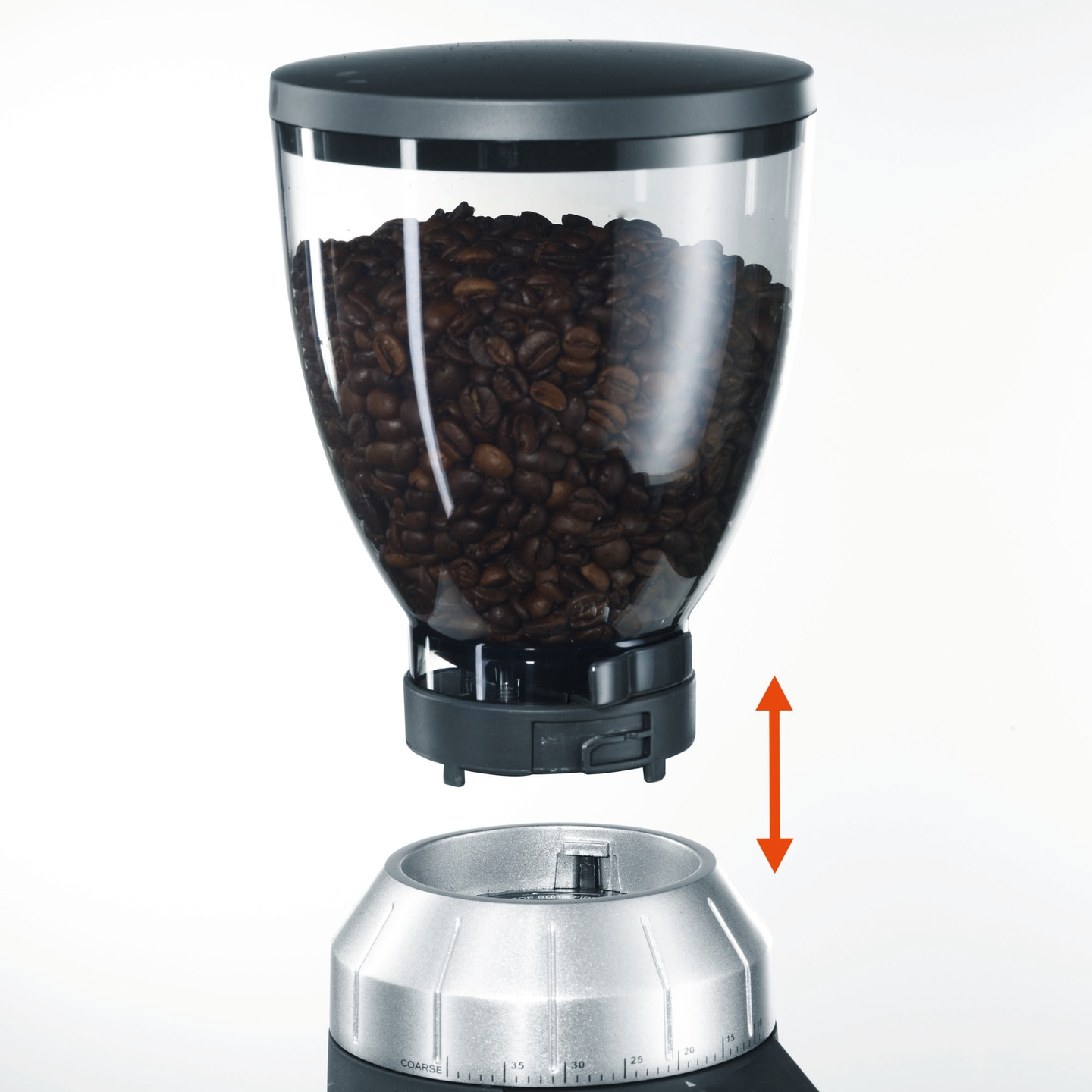 Kaffeemühle mit Bohnen, Pfeil zeigt die Richtung der Montage an.