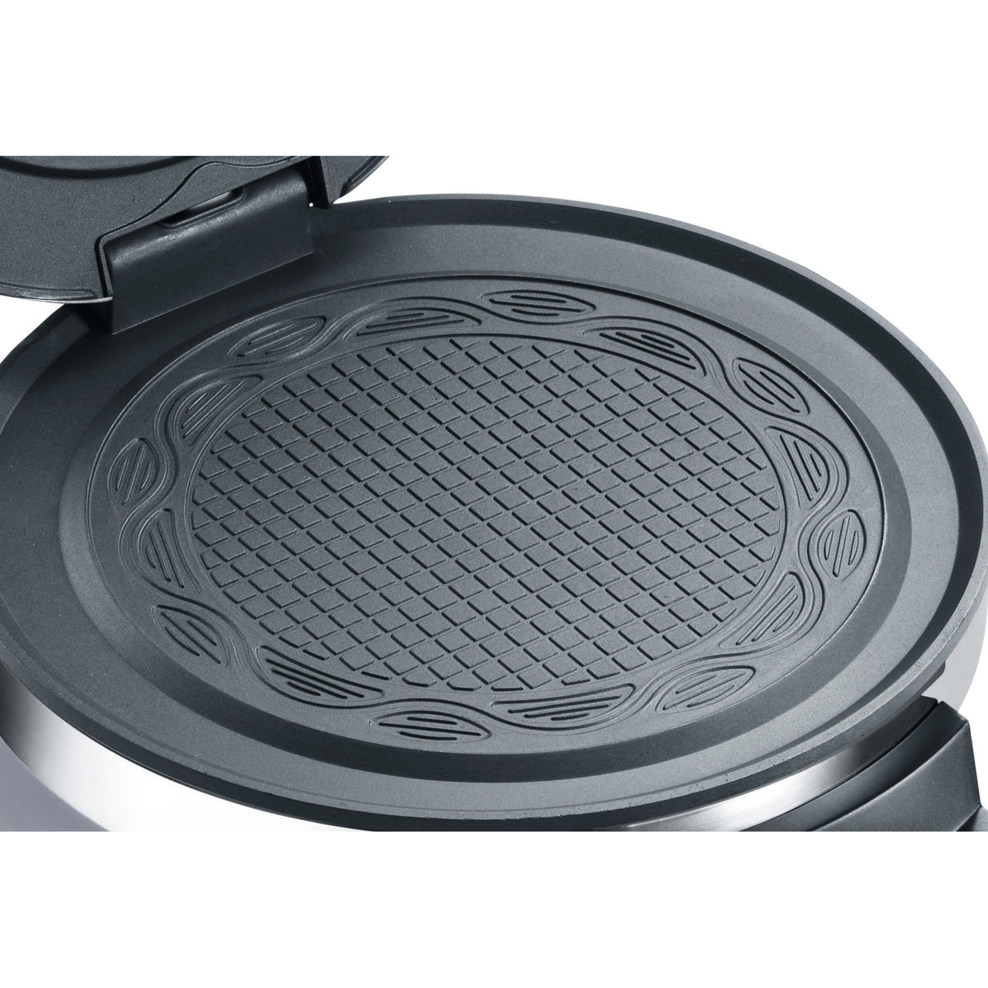 Close-up of a waffle iron with waffle grid and decorative border