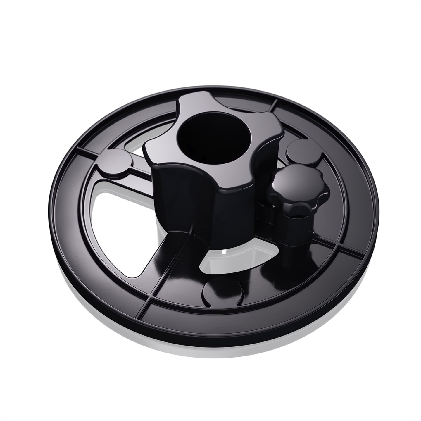 Black plastic base with knobs and holes for a machine or device, isolated.